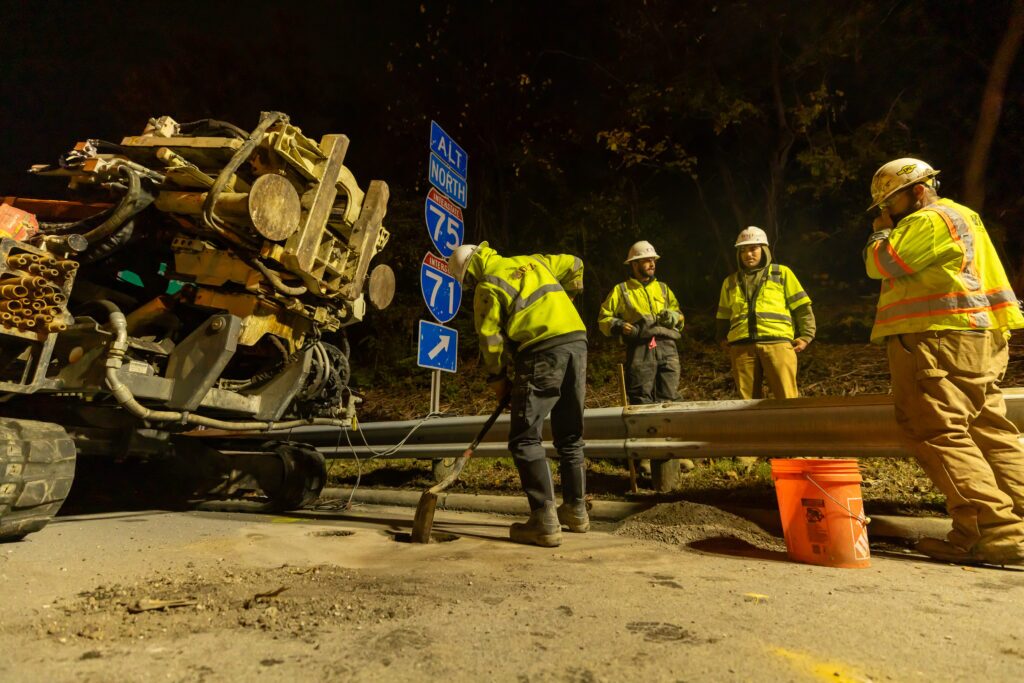 Construction Workers Digging a Hole